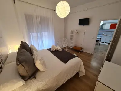 a bedroom with a large white bed in a room at Alojamientos Segóbriga Rural (Montaña) in Segorbe