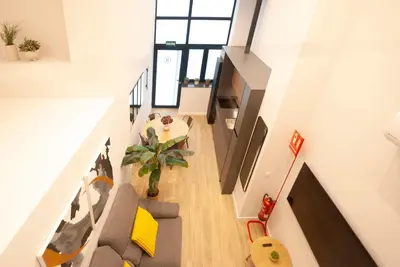 a living room with a couch and a table at LOFT Accommodative B in Valencia