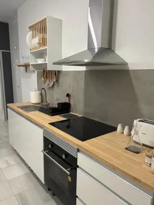 a kitchen with a sink and a stove top oven at Mediterranéo in Valencia
