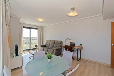 a living room with a table and a couch at GuestReady - Lovely flat with views in Valencia in Valencia