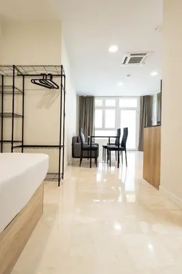 a living room with a bed and a table and chairs at Vera Suites by Concept Flats in Valencia