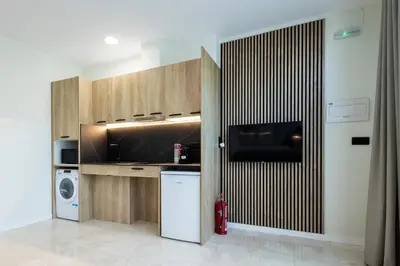 a kitchen with a refrigerator and a fire hydrant at Vera Garden by Concept Flats in Valencia