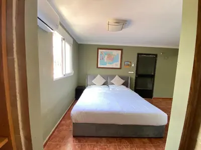 a bedroom with a white bed in a room at Guesthouse in Torrent in Valencia