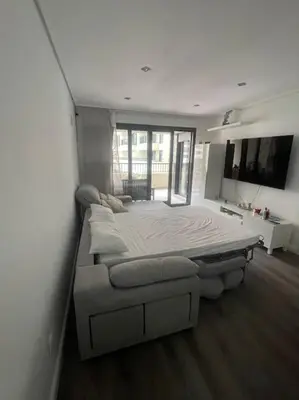 a bedroom with two beds and a large window at Apartamento playa Veramar patacona in Valencia
