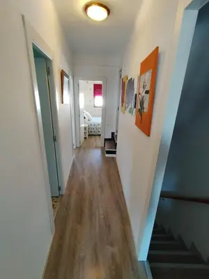 a hallway with a stairway leading to a room at rural relax Valencia in Villar del Arzobispo