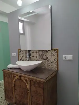 a bathroom with a sink and a mirror at rural relax Valencia in Villar del Arzobispo