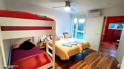 a bedroom with two bunk beds and a window at All Nature Villa-25min from Valencia in Valencia