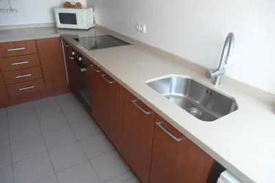 a bathroom with a toilet and a sink and a shower at Voramar Serviplaya Solo Familias in Casas Las Basas