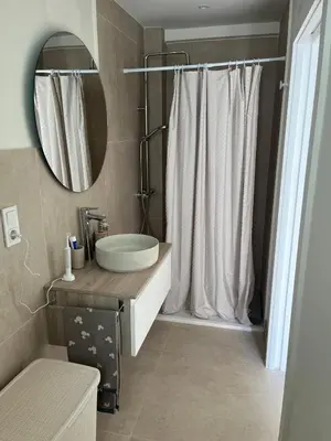 a bathroom with a sink and a mirror at Ca Erika in Aldaia