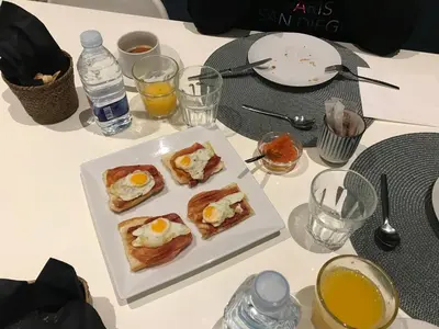 a table with a plate of breakfast foods and drinks at L'Esplai Valencia in Valencia