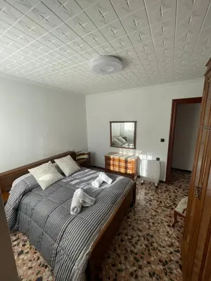 a bedroom with a dog laying on a bed at Casa Rural Piker in Bolbaite