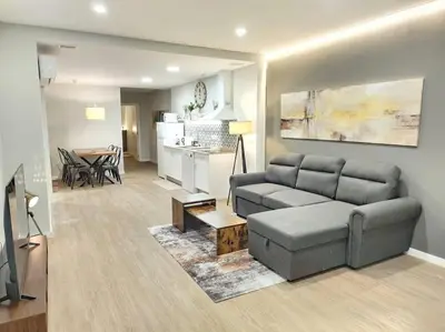 a living room with a couch and a table at Arquitecto D in Valencia