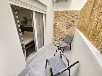 a small table and two chairs on a balcony at Arquitecto I in Valencia
