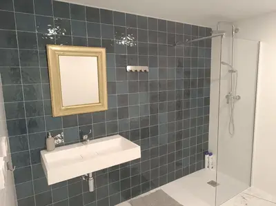 a bathroom with a sink and a mirror and a shower at Explore Valencia! Tirant, city of science & Ruzafa in Valencia