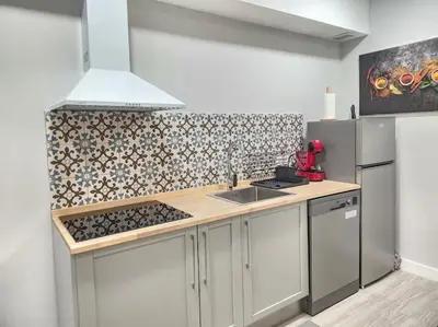 a kitchen with a sink and a stove top oven at Valencia experience! Plus,science city & Ruzafa in Valencia