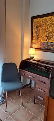 a desk with a chair and a lamp on it at La Casa del Olivo en Montserrat - Valencia in Valencia