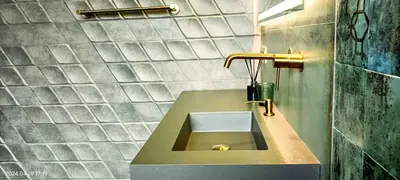 a bathroom with a sink and a gold faucet at The Blue Diamond Villa-25min to Valencia in Turís