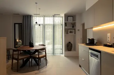 a kitchen with a table and a dining room at Dorm4You Arena in Valencia