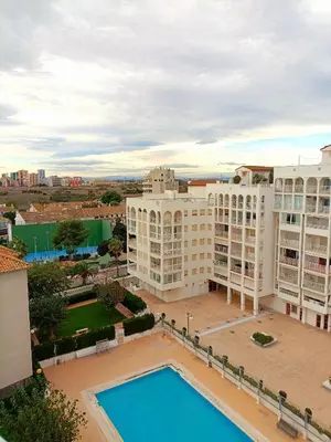 an aerial view of a building with a pool at Play-Puig Beach Flat in El Puig
