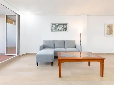 a living room with a couch and a coffee table at Montolivet Gulliver in Valencia