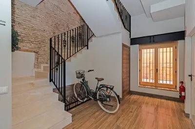 a bike parked next to a staircase in a house at Maritime Apartamentos Puerto in Valencia