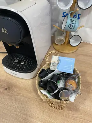 a basket of items sitting next to a toaster at ALZIRA BONITA APARTAMENTO CON TERRAZA Y JACUZZi EXTERIOR in Alzira