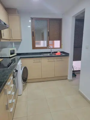 a kitchen with a sink and a dishwasher at APARTAMENTO MODERNO y ACOGEDOR in Canet de Berenguer