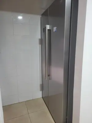 a stainless steel refrigerator in a white kitchen at APARTAMENTO MODERNO y ACOGEDOR in Canet de Berenguer