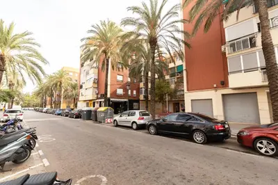 a street with cars parked on the side of the road at GuestReady - Apartamento en Benicalap in Valencia