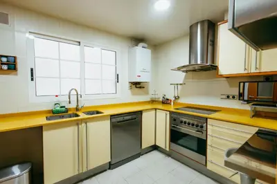 a kitchen with a sink and a stove at Apt Ruzafa, City Centre 10 Min, Terrace, 2 Rooms in Valencia