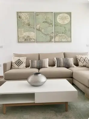 a living room with a couch and a coffee table at Espectacular apartamento en Cullera con vistas al mar in Faro de Cullera