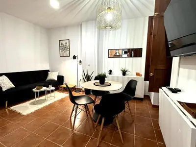 a living room with a table and a couch at Guillem Silence in Valencia