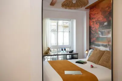 a bedroom with a bed and a window at Casual Natura Valencia in Valencia