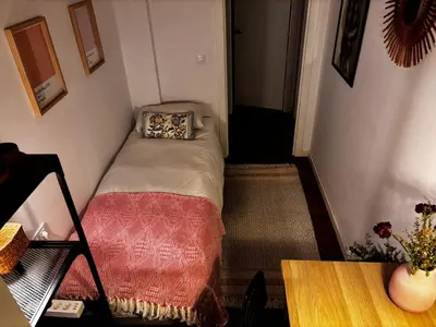 a small room with a bed and a table at GuestReady - Elegant Retreat in Valencia in Valencia