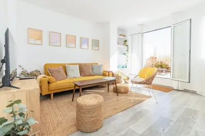 a living room with a yellow couch and a table at GuestReady - Elegant Retreat in Valencia in Valencia