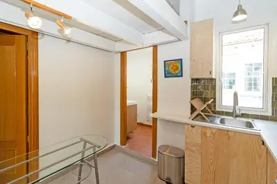 a kitchen with a sink and a counter top at GuestReady - Charming stay in the Heart of Russafa in Valencia