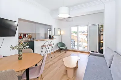 a living room with a table and a couch at GuestReady - Valencia's Sushine Terrace in Valencia
