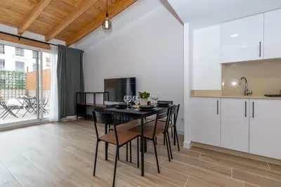 a kitchen and dining room with a table and chairs at GuestReady - Superb retreat in Ruzafa in Valencia