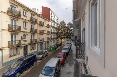 a row of cars parked on a street next to buildings at GuestReady - Superb retreat in Ruzafa in Valencia