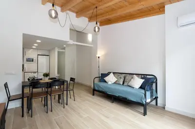a living room with a blue couch and a table at GuestReady - Superb retreat in Ruzafa in Valencia