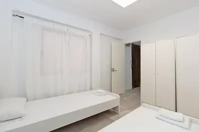 a white room with a bed and a window at GuestReady - A lovely gem near La Malvarrosa beach in Valencia