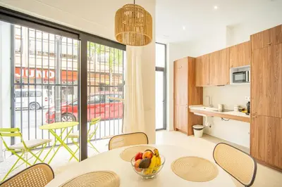 a kitchen and dining room with a table and chairs at VLC HOST- Islas Canarias in Valencia