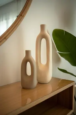 two vases sitting on top of a wooden shelf at Design Apartment with swimming pool Ciudad de Ciencias in Valencia