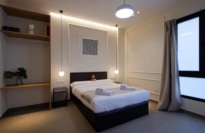 a bedroom with a bed with towels on it at Osito Hub - Llorens in Valencia