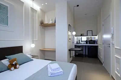 a bedroom with a bed with a teddy bear on it at Osito Hub - Llorens in Valencia