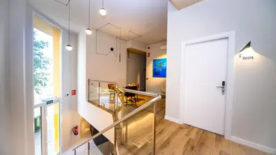 a room with a glass staircase and a white door at Hotel Sleep Turia music & art in Lliria