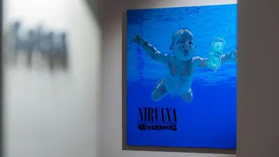 a poster for a movie on a wall at Hotel Sleep Turia music & art in Lliria