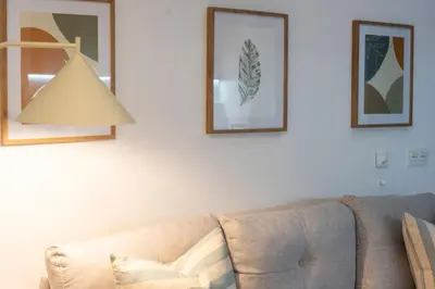 a living room with a couch and a lamp at VLC HOST - Ausias March in Valencia
