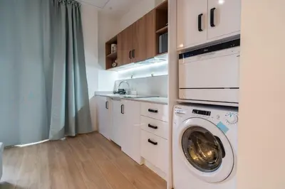 a kitchen with a washing machine and a sink at VLC HOST - Ausias March in Valencia