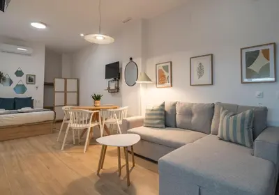 a living room with a couch and a table at VLC HOST - Ausias March in Valencia